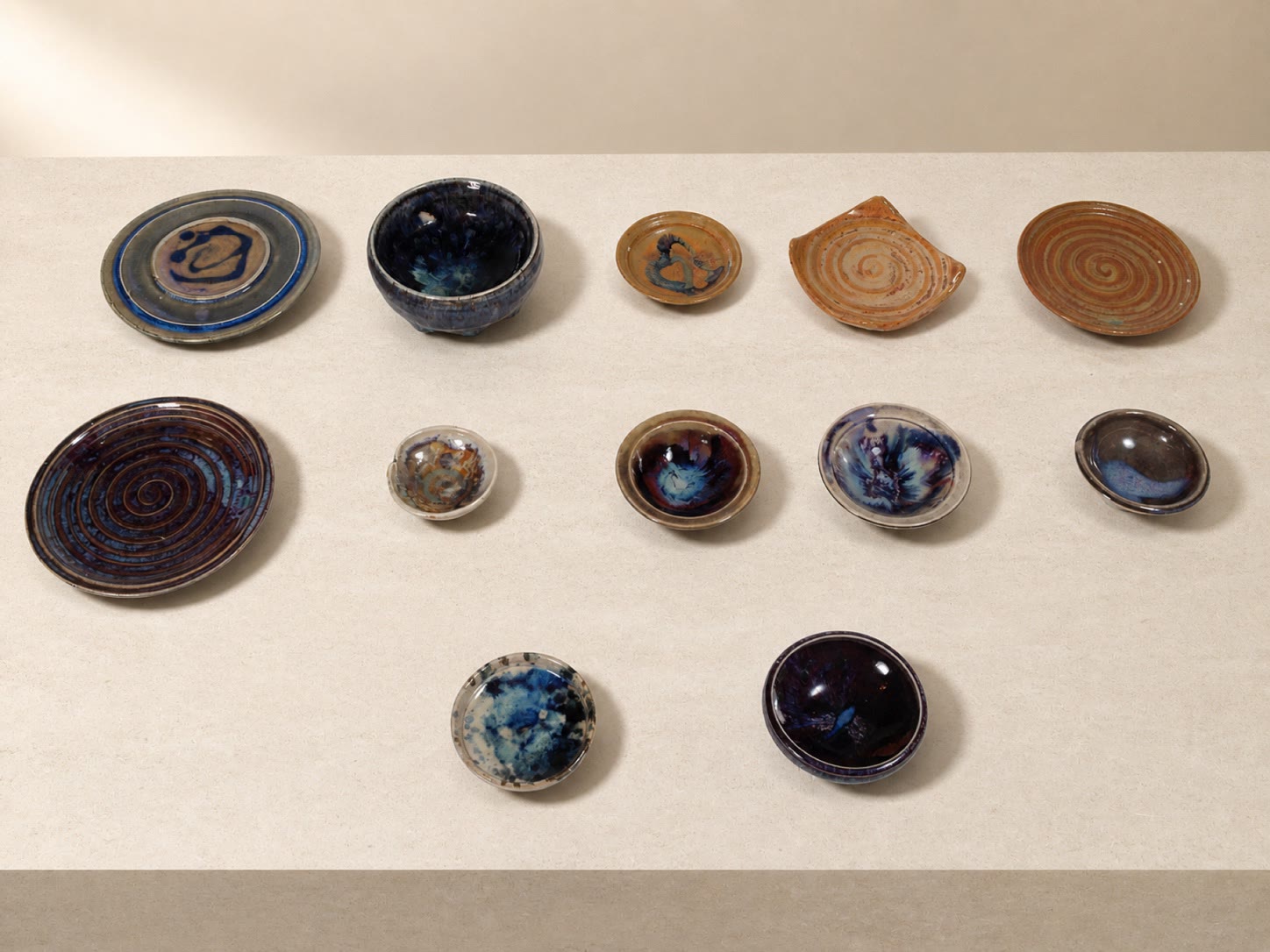 Glazed ceramic plates and small dishes