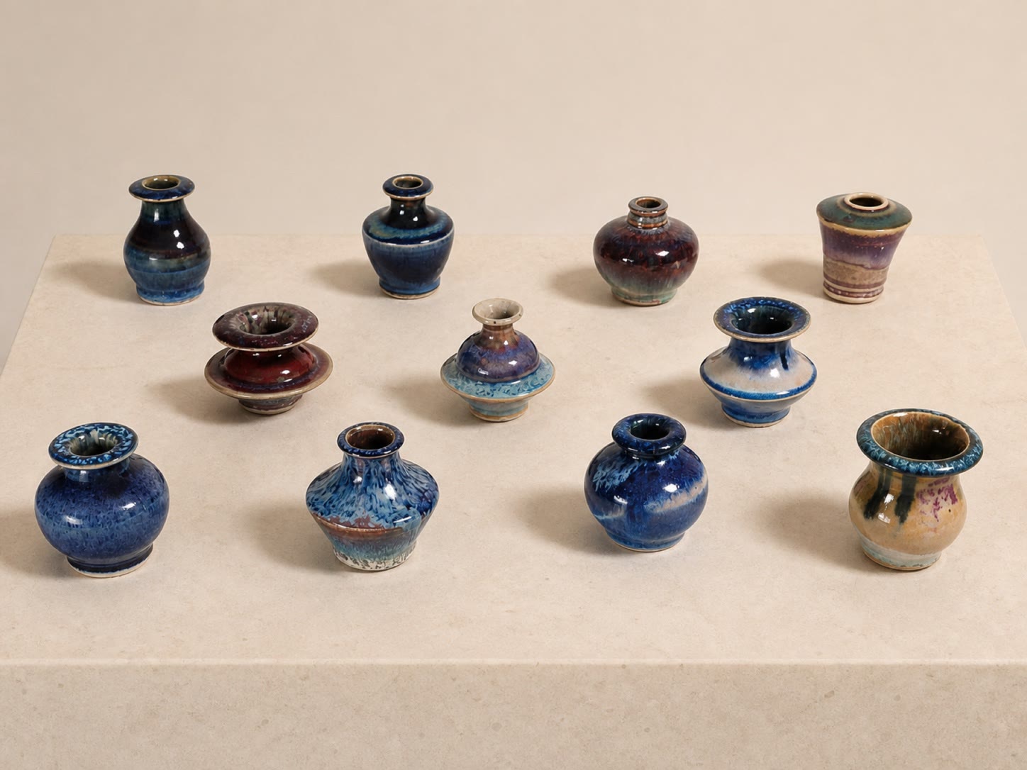 A group of miniature glazed ceramic vessels